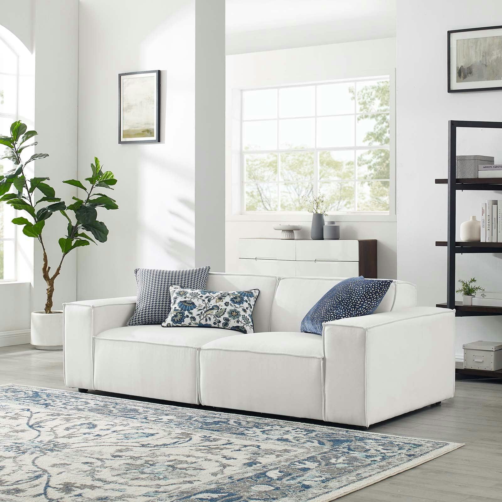 Elegant White Two-Piece Sectional Sofa with French Piping